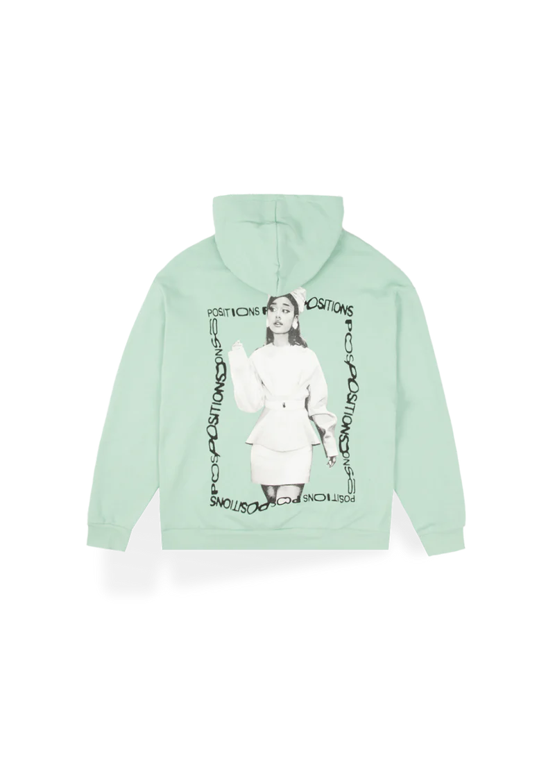 Mint green Ariana Grande Positions hoodie back view with monochrome portrait artwork and circular logo design