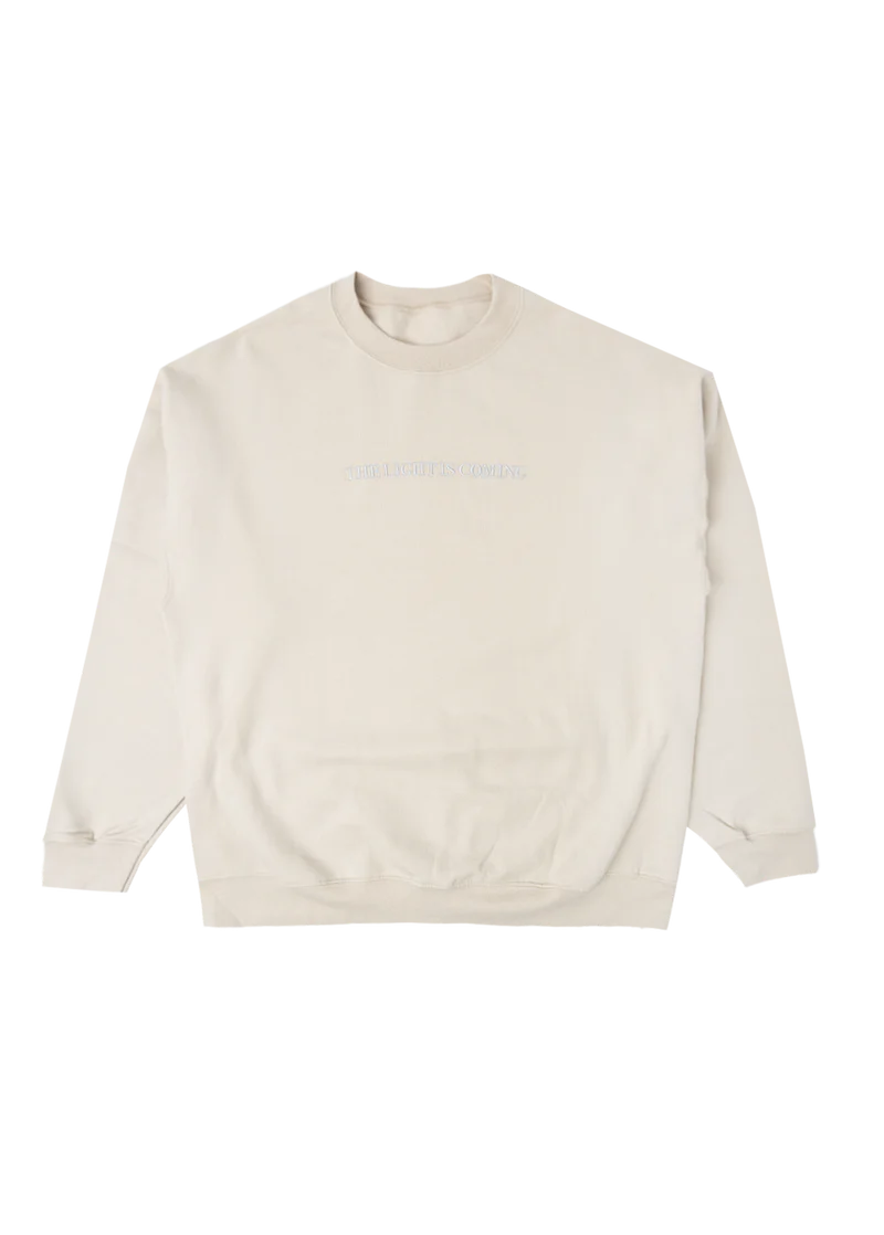 Cream Ariana Grande The Light Is Coming crewneck with minimalist embroidered text and oversized cozy sweatshirt fit