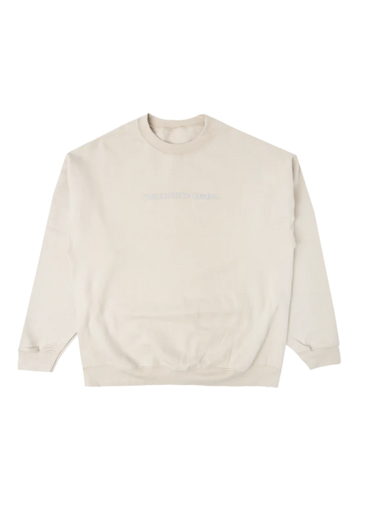 Cream Ariana Grande The Light Is Coming crewneck with minimalist embroidered text and oversized cozy sweatshirt fit
