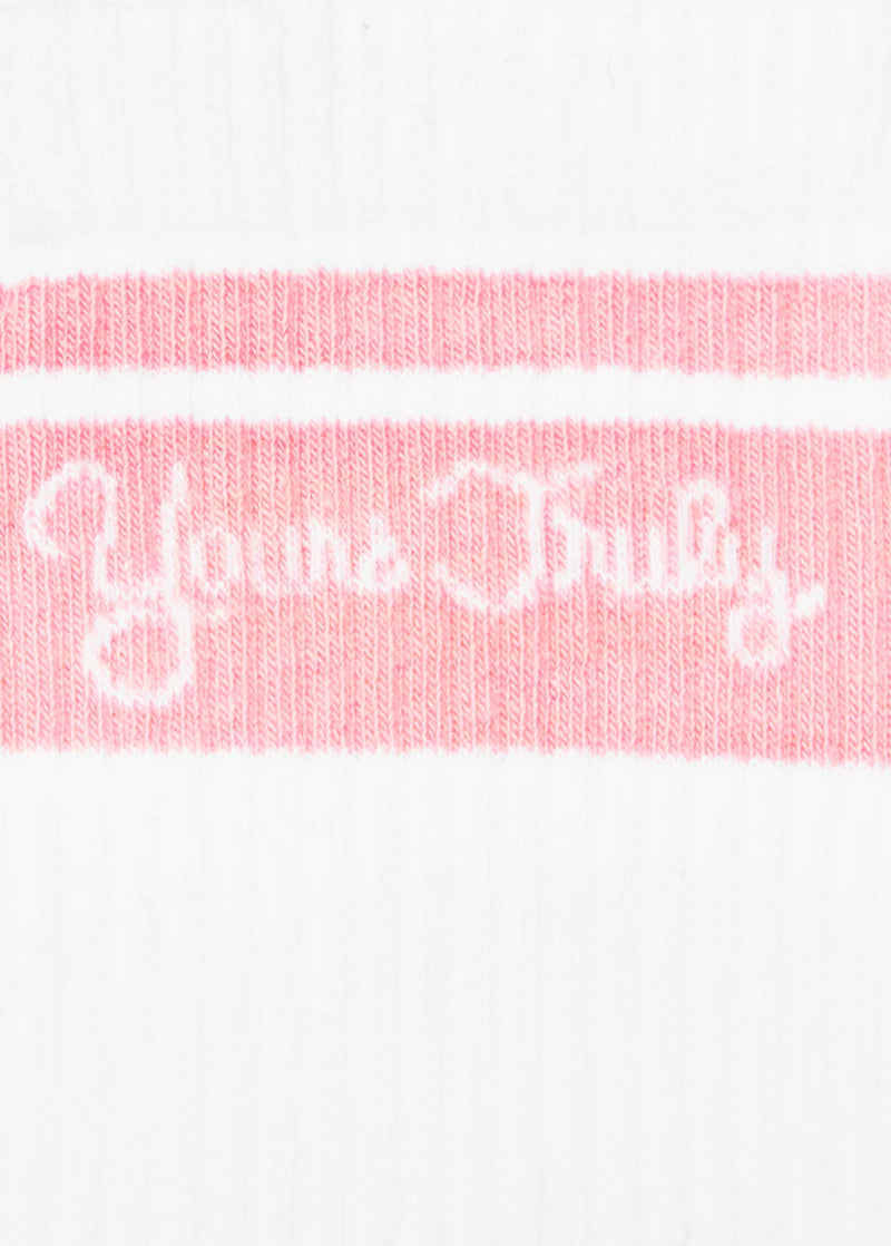 Close-up of pink Yours Truly logo knit detail on white Ariana Grande anniversary crew socks