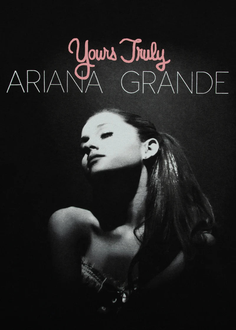 Close-up Ariana Grande Yours Truly puff print graphic on black anniversary merch t-shirt
