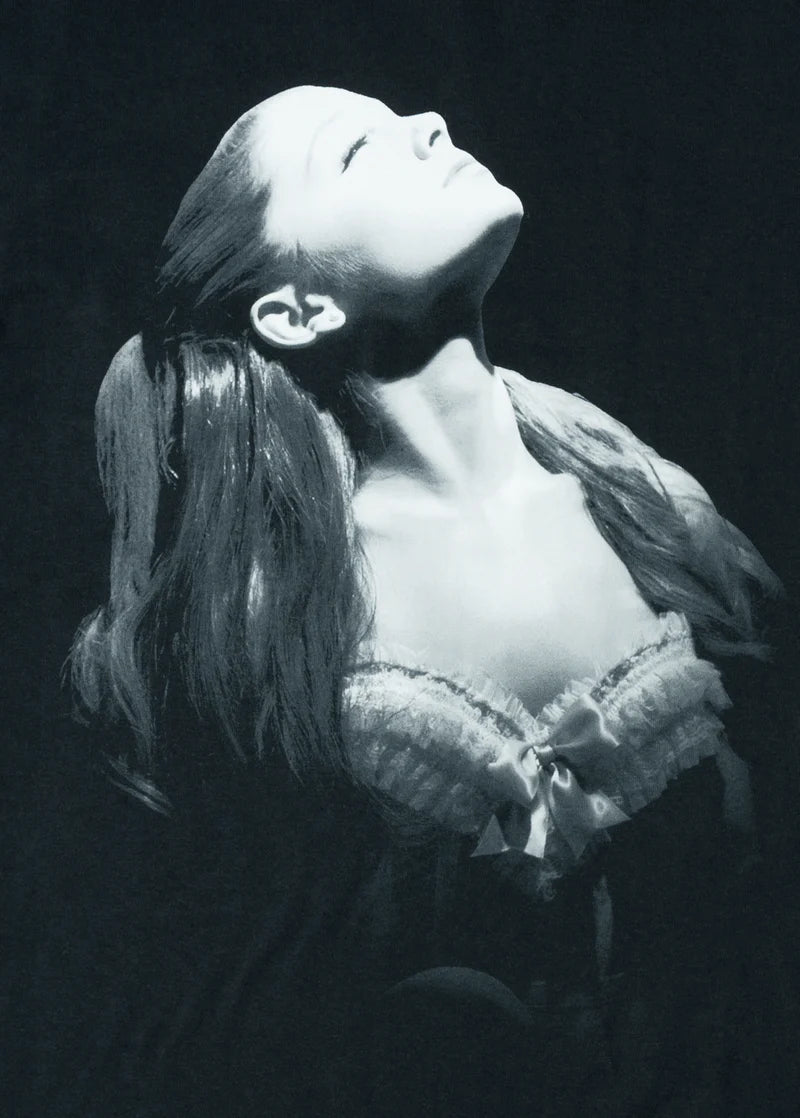 Close-up monochrome Ariana Grande portrait graphic on black Yours Truly merch t-shirt